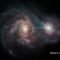 Observan un par de galaxias en una batalla en el espacio profundo